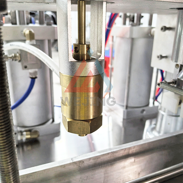 エアゾール充填機の充填システム