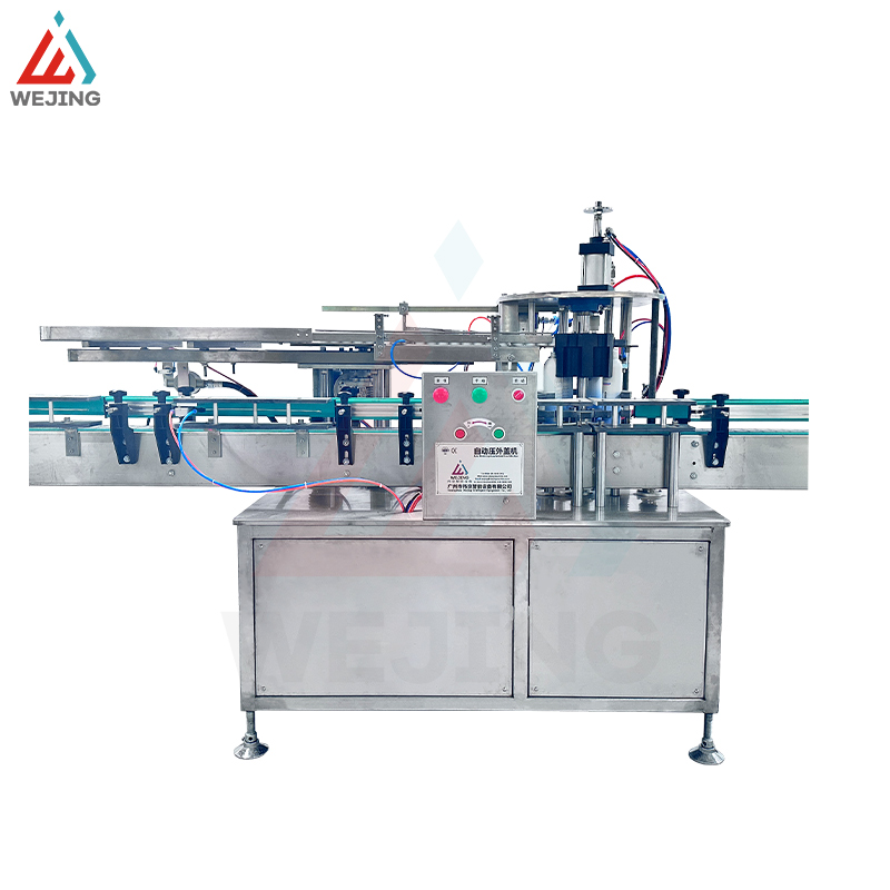 キャップ挿入押え機